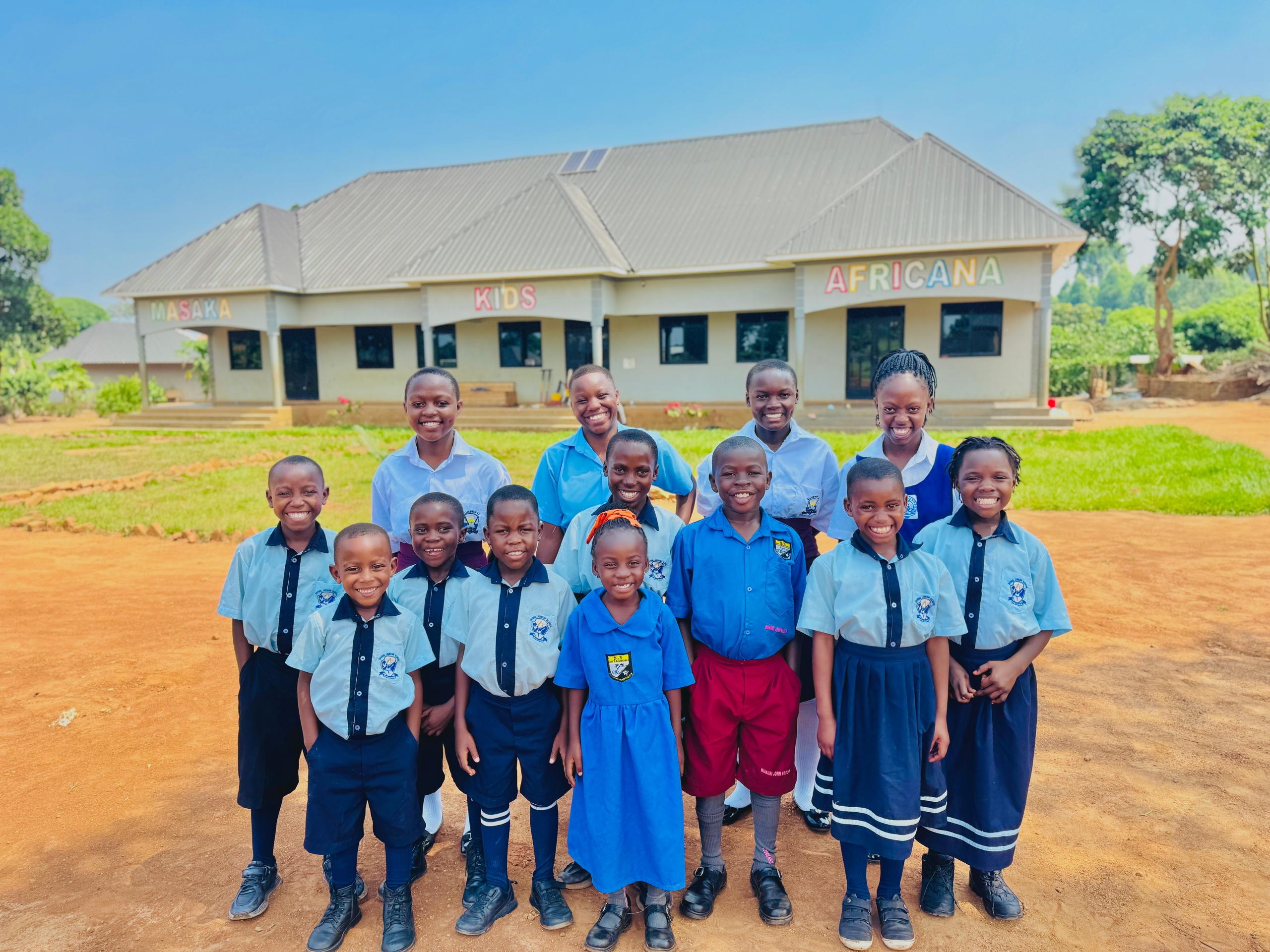 Helping the children of Masaka Kids Africana to go to school.